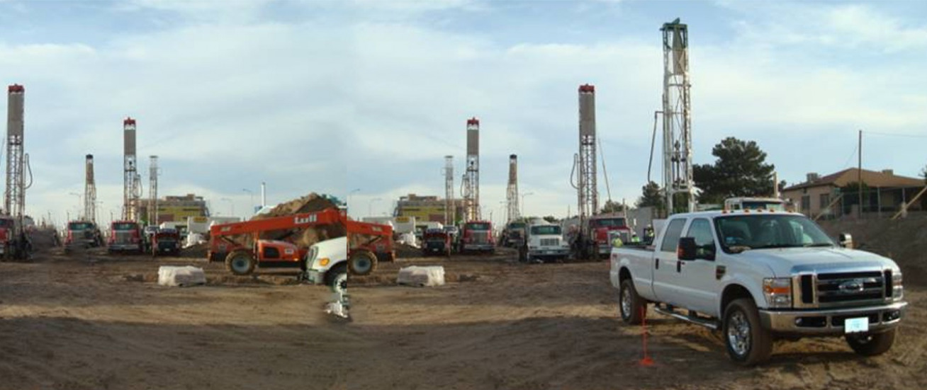 A truck in front of a drilling operation